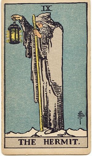 The Hermit: An old man in a grey hooded cloak stands on a snowy peak, holding a lantern with a six-pointed star in one hand and a staff in the other.