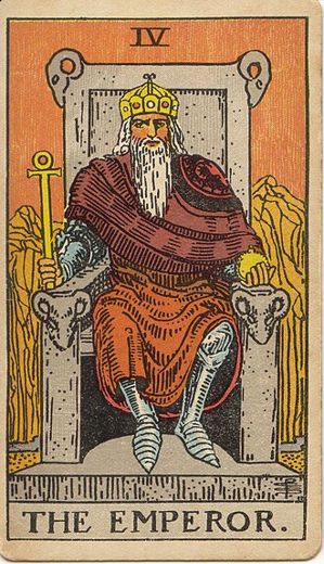 The Emperor: A bearded ruler in armour and a red cloak sits on a stone throne carved with rams' heads, holding a sceptre and an orb, with bare mountains behind him.