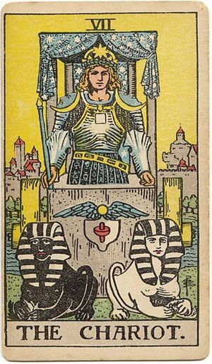 The Chariot: A crowned charioteer in armour stands in a stone chariot beneath a canopy of stars; a black and a white sphinx lie before him, and there are no reins.