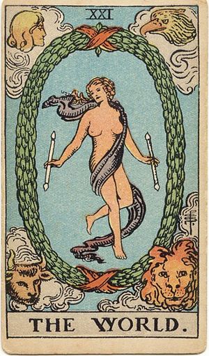 The World: A dancing figure wrapped only in a sash floats inside an oval laurel wreath, holding two wands, with an angel, an eagle, a bull and a lion in the four corners.
